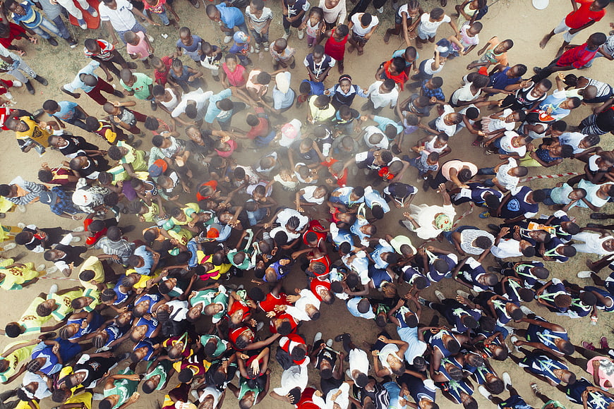 Aerial view of large crowd of people looking up