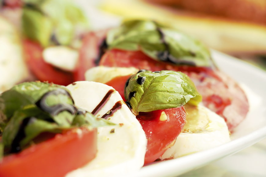 Close-up of fresh Caprese salad with tomato, mozzarella, and basil