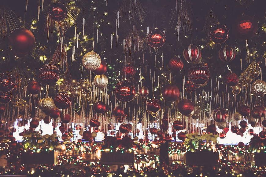 Festive Christmas Ornaments Hanging in a Department Store