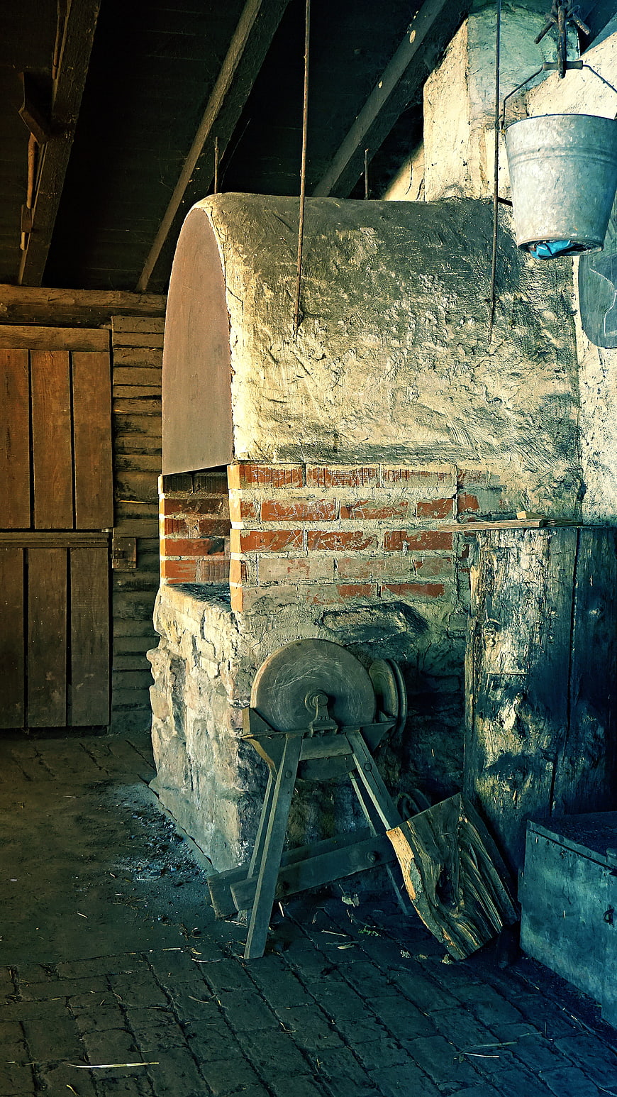 Rustic Stone Oven in Old Wooden Barn Interior