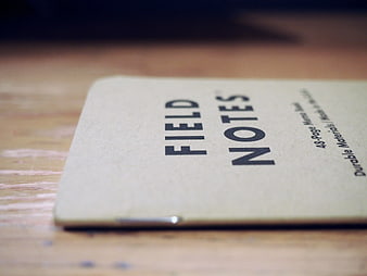Close-up of Field Notes Notebook on Wooden Desk