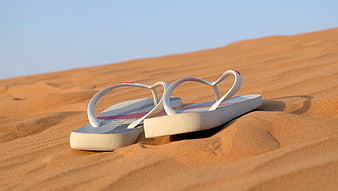 White Flip-flops on Sand Dunes