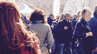 Crowd of People Walking on City Street