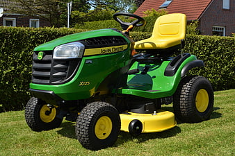 John Deere X125 Ride-On Lawn Mower On Green Grass