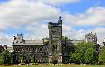 Historic Gothic Revival University Building on Sunny Day