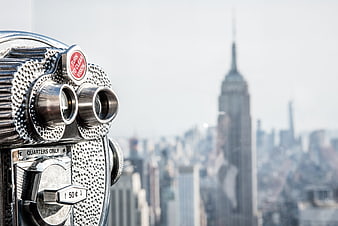 Coin-operated binoculars with Empire State Building skyline background