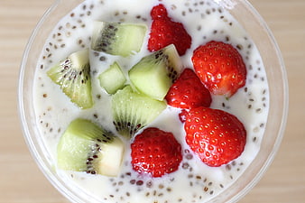 Overhead view of chia seed yogurt bowl with fresh strawberries and kiwi