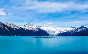 Turquoise Alpine Lake with Snow-Capped Mountains and Glaciers