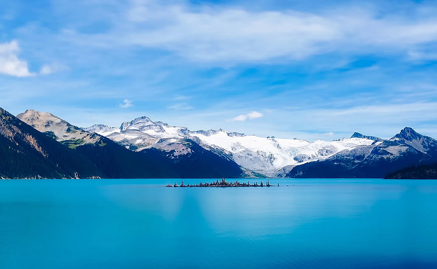 Turquoise Alpine Lake with Snow-Capped Mountains and Glaciers