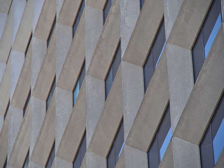 Abstract Diagonal Concrete Building Facade with Windows