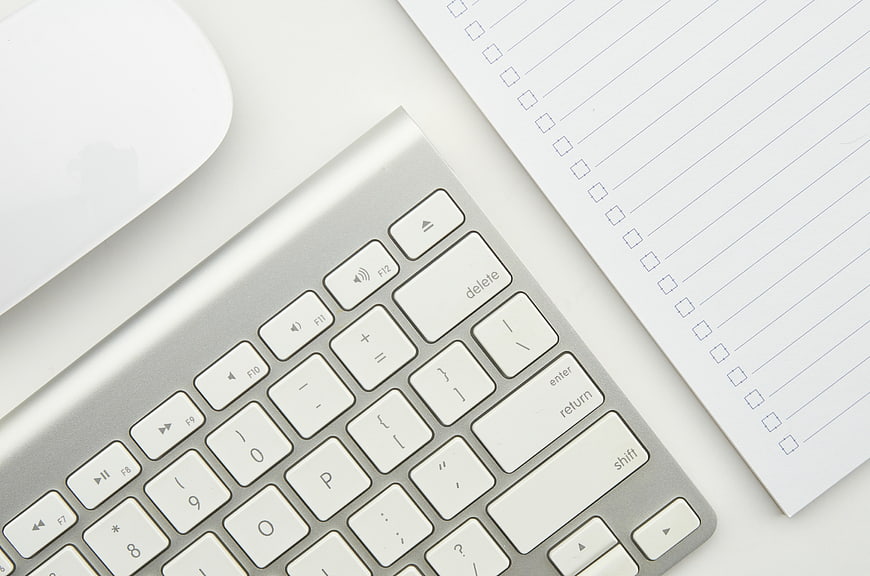 Minimalist Workspace with Keyboard and Notepad