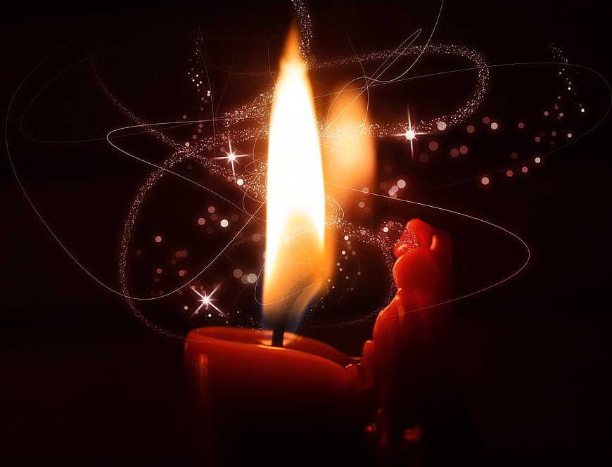 Red Candle Flame With Magical Sparkles And Starbursts On Black Background
