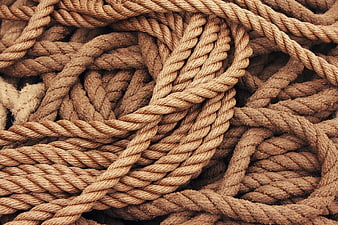 Close-up texture of tangled brown twisted rope