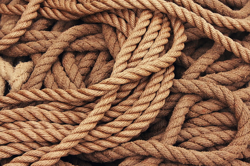 Close-up texture of tangled brown twisted rope
