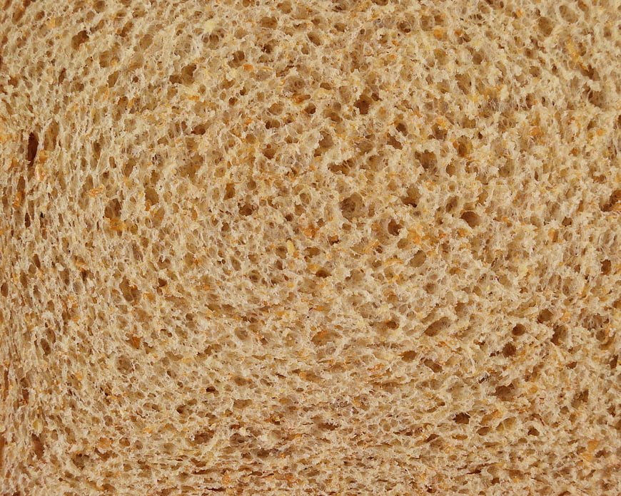 Close-up texture of sliced whole wheat bread crumb