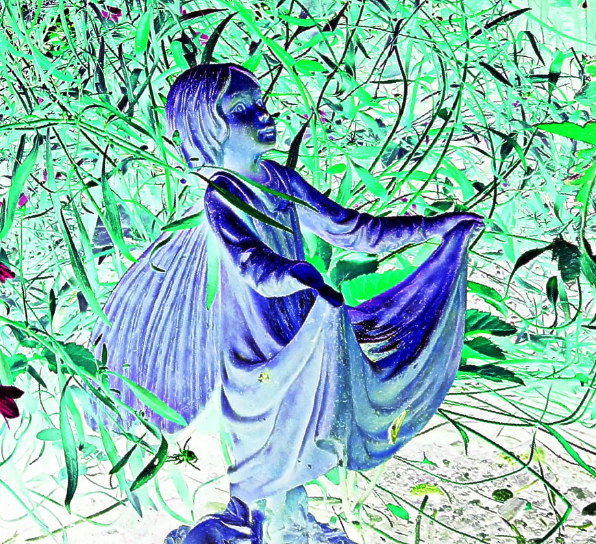 Blue Fairy Statue in Overgrown Garden