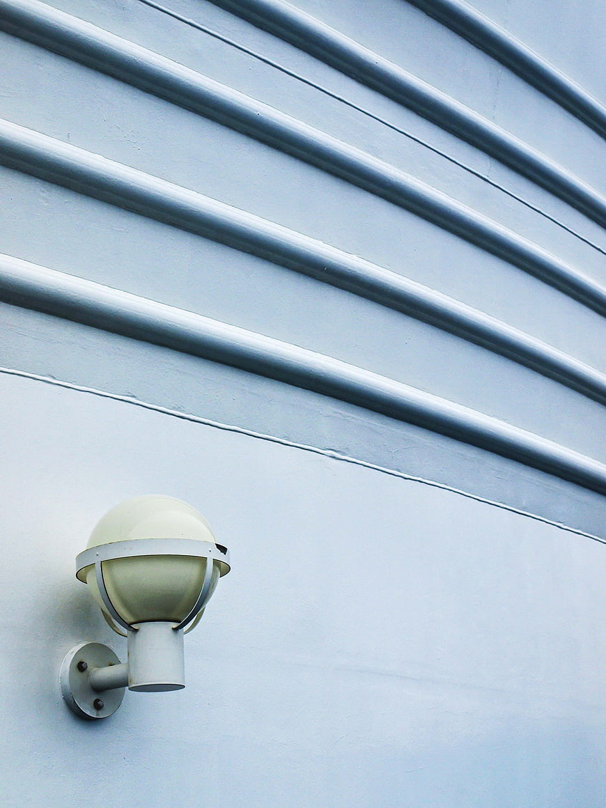 Minimalist Exterior Wall Lamp on Blue Siding