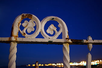 Rusted White Ironwork Against Deep Blue Night Sky