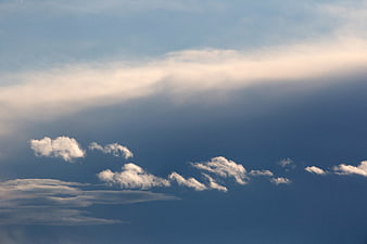 Dramatic Blue Sky with Fluffy White Clouds and Sunbeats