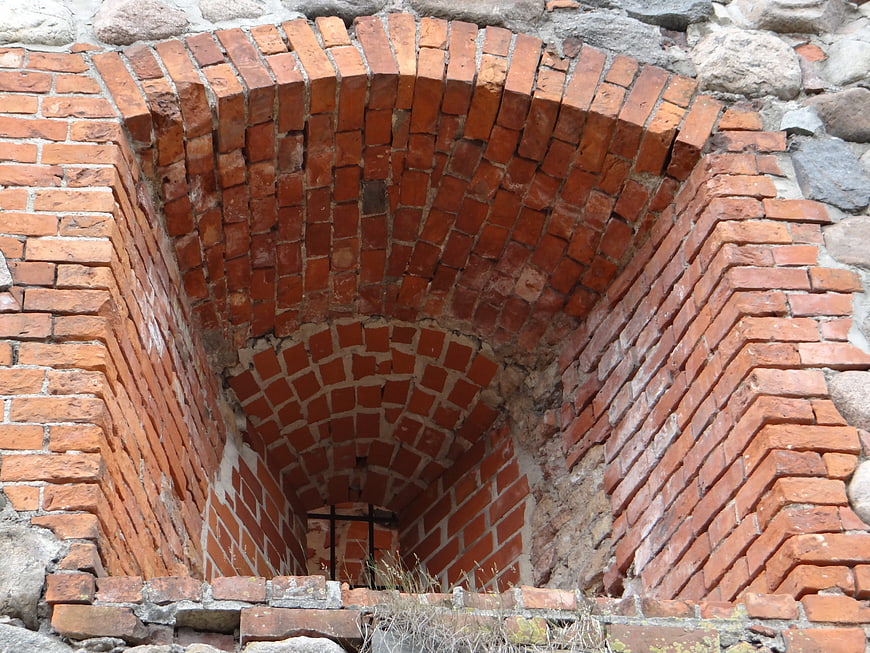 Ancient red brick archway in historic castle ruins