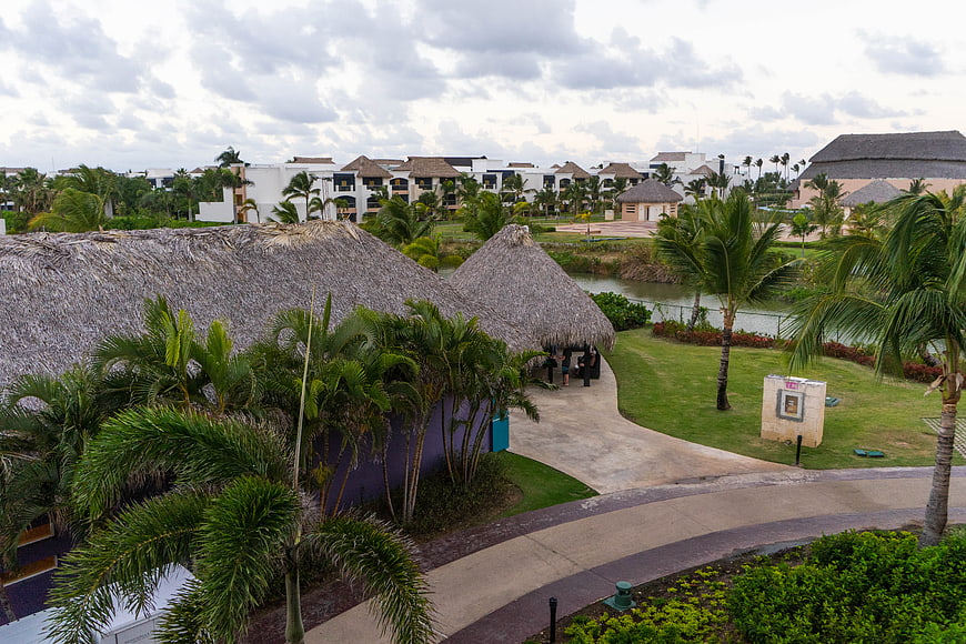 Tropical Resort with Thatched Roofs and Palm Trees
