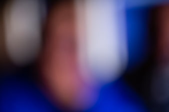 Abstract Blurred Background with Blue, Red, and White Bokeh