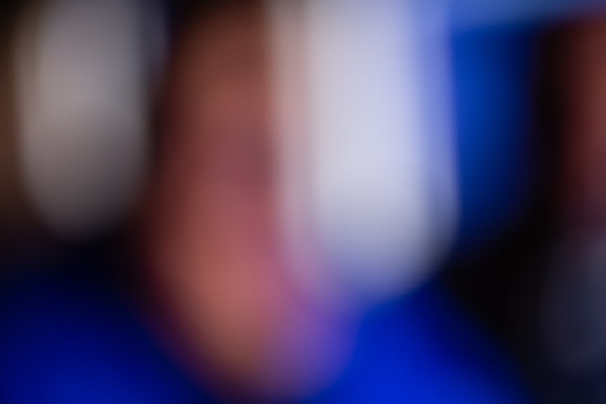 Abstract Blurred Background with Blue, Red, and White Bokeh