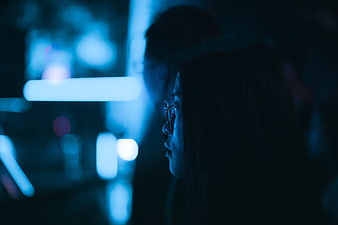 Woman in Profile with Blue Bokeh Lights