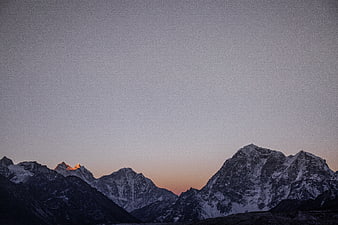 Snowy Mountain Peaks at Dusk with Alpenglow