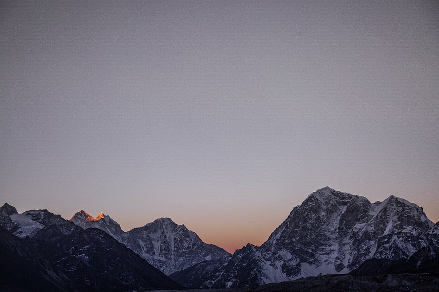 Snowy Mountain Peaks at Dusk with Alpenglow