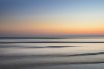 Serene Long Exposure Sunset Ocean Beach Landscape