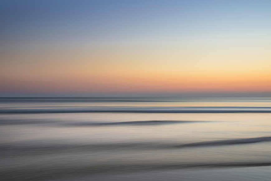 Serene Long Exposure Sunset Ocean Beach Landscape