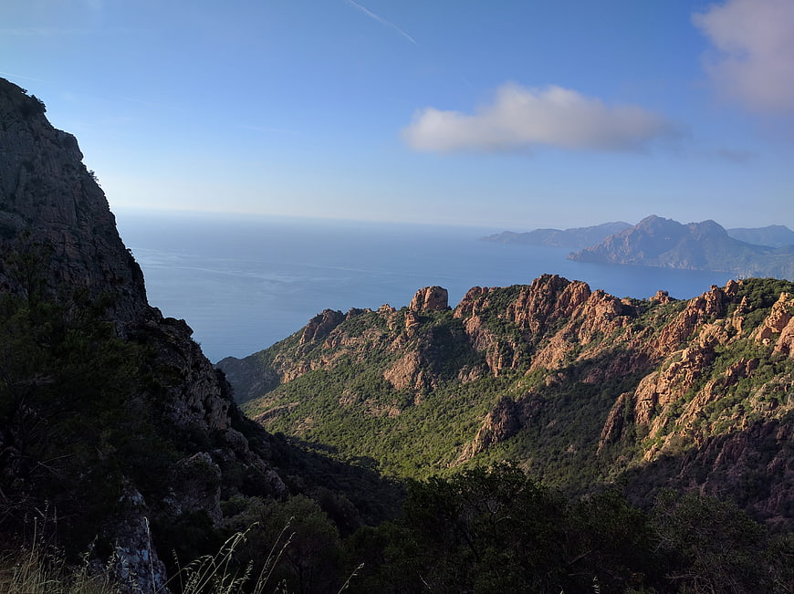 Scenic View of Rugged Mountains and Blue Sea in Corsica