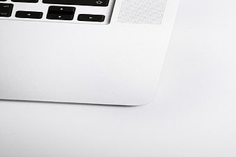 Minimalist White Laptop Corner Close-Up