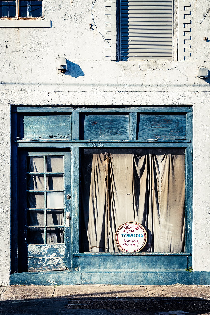 Vintage Blue Storefront with Jesus and Tomatoes Sign