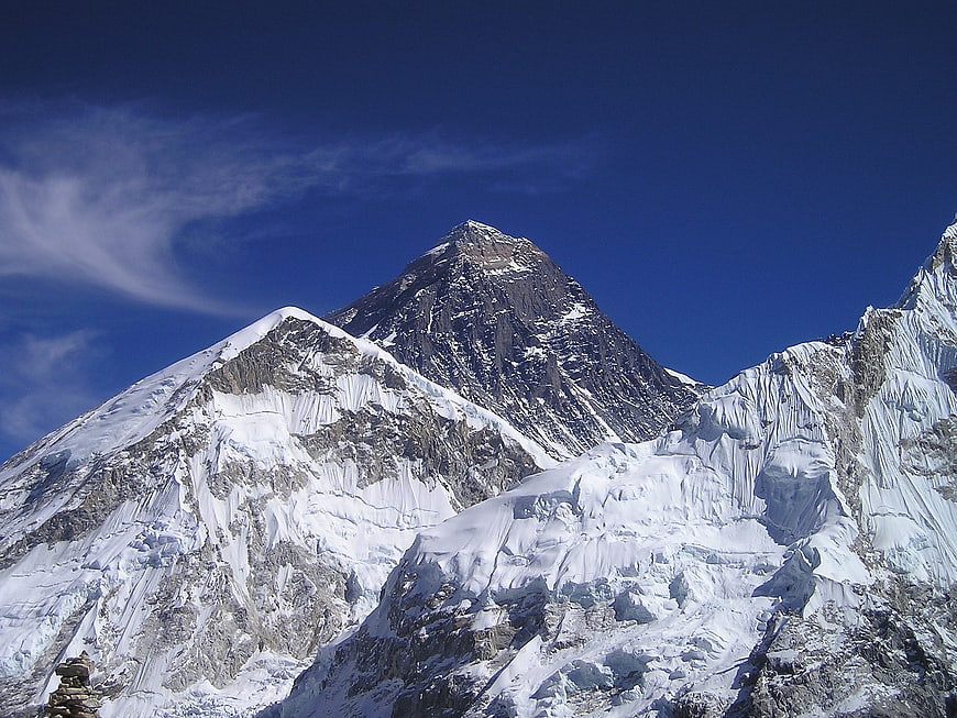 Majestic Snow-Capped Mountain Peak Against Blue Sky