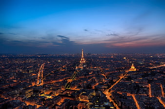 Aerial View of Paris Cityscape at Dusk with Eiffel Tower