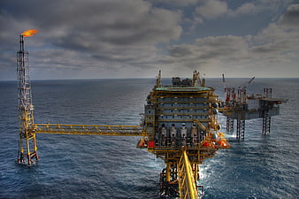 Offshore oil rig platform with gas flare in ocean