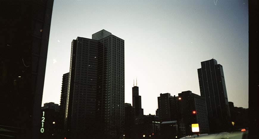 Vintage Film Cityscape at Dusk with Skyscrapers