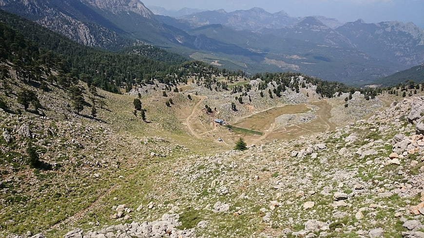 Rugged mountain landscape with rocky terrain and distant peaks