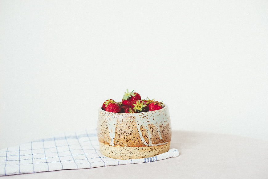 Ceramic Bowl of Fresh Strawberries on White Background