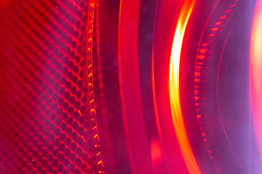Abstract Red Geometric Pattern with Glowing Light Streaks