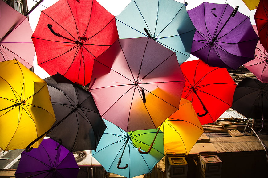 Colorful Umbrellas Hanging Above Urban Street