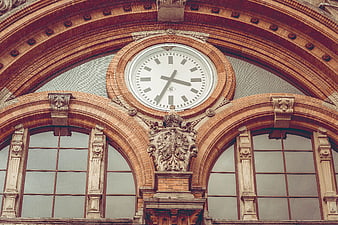 Ornate Brick Clock Tower with Arched Windows