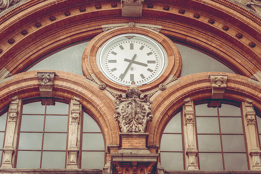 Ornate Brick Clock Tower with Arched Windows