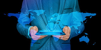 Businessman holding tablet with holographic world map projection