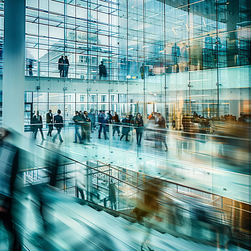 Motion Blur Business People in Modern Glass Office Lobby