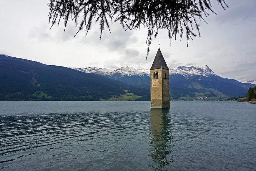 Bell Tower of Resia Lake in the Alps