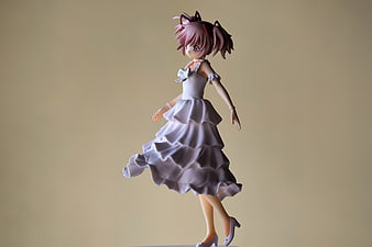 Anime Girl Figurine In White Dress On Beige Background