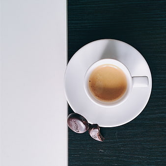 Top view of espresso coffee and chocolate on dark table
